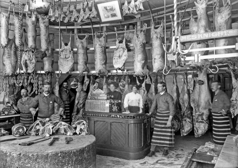 A butcher’s shop in Christchurch NZ in 1910. It would look familiar to customers from 1870, except for the telephone and the cash register. Edited.

(ATL 1/1-004208-G)